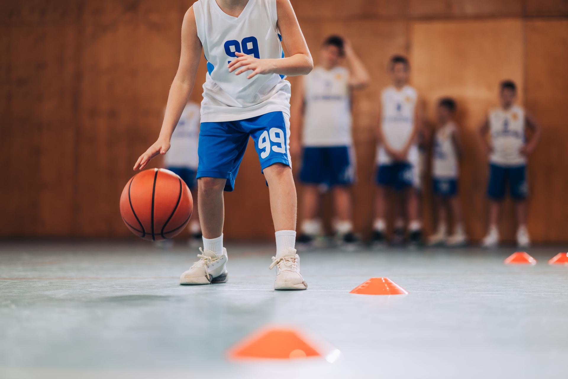 Young basketball player practicing skills
